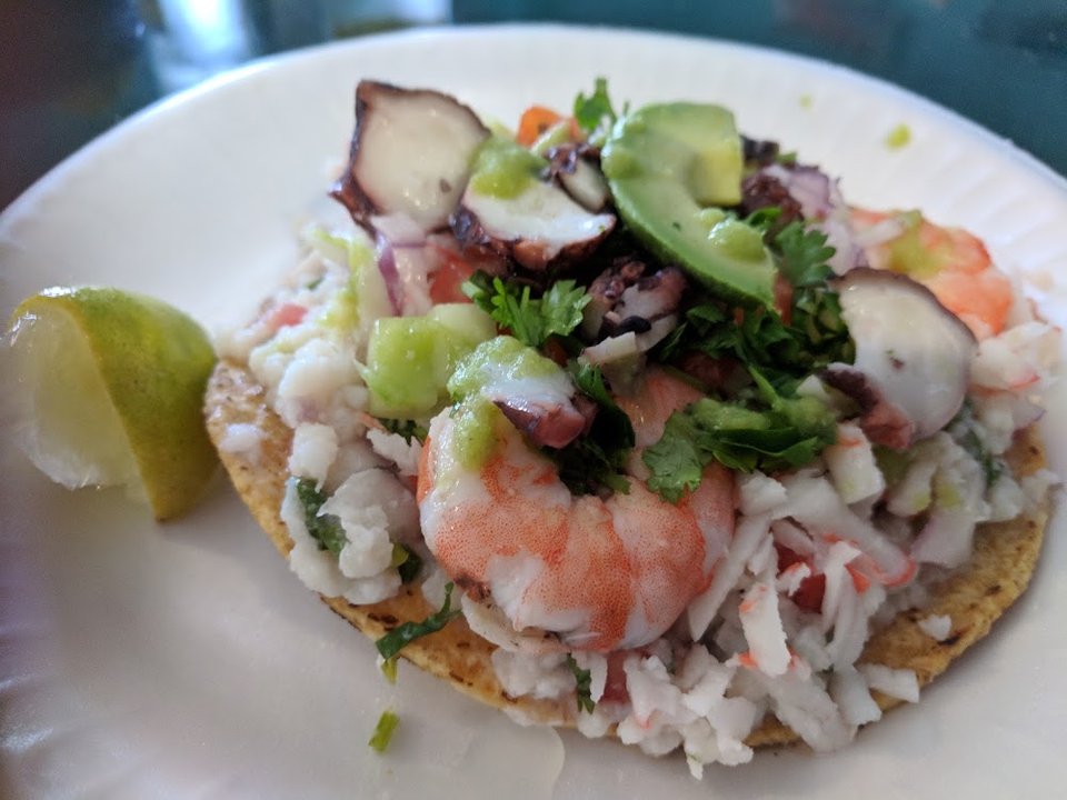 Menu page listing shrimp, fish, and ceviche dishes.